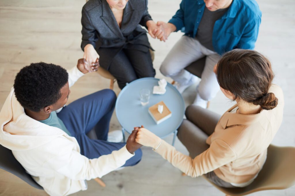 A group of people sitting around a table.